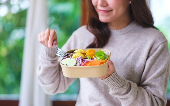 Closeup,Image,Of,A,Woman,Eating,Vegetables,Salad,At,Home,