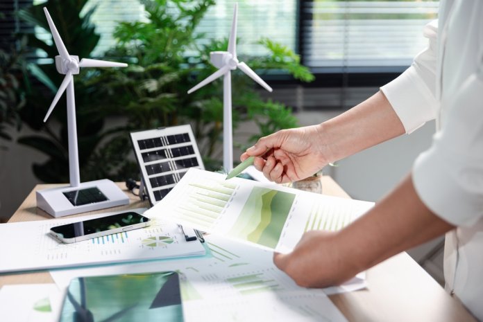 Sustainability,Analyst,Points,To,Green,Esg,Charts,On,Paper,Report